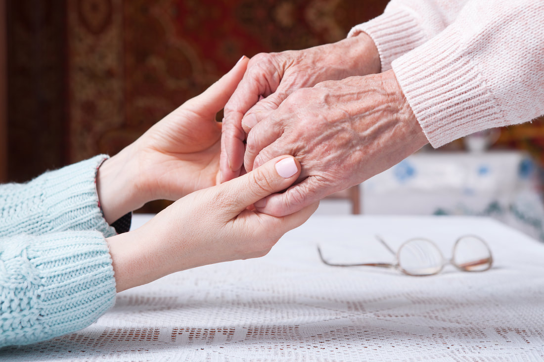Holding Hands between Caregiver and Elderly