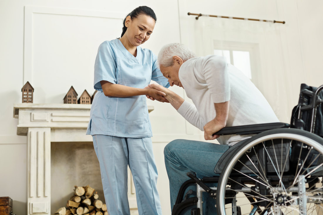 Smiling Caregiver Assisting Elderly