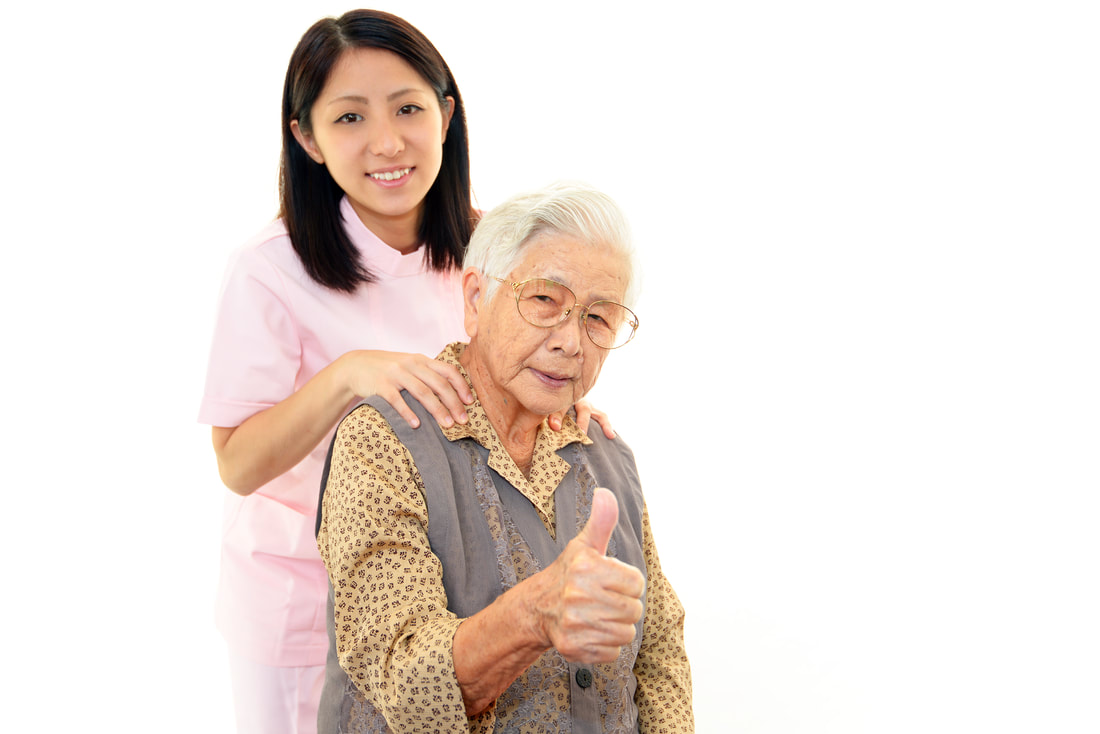 Caregiver with Elderly Lady with a Thumbs-Up
