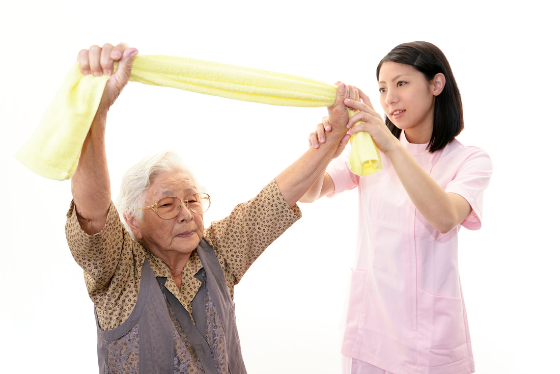 Live-in caregiver helping grandma to exercise